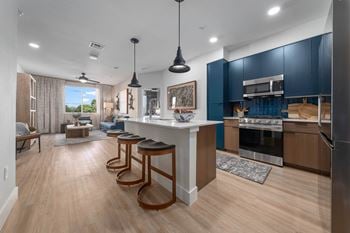 Two design schemes featuring contrasting upper and lower cabinets